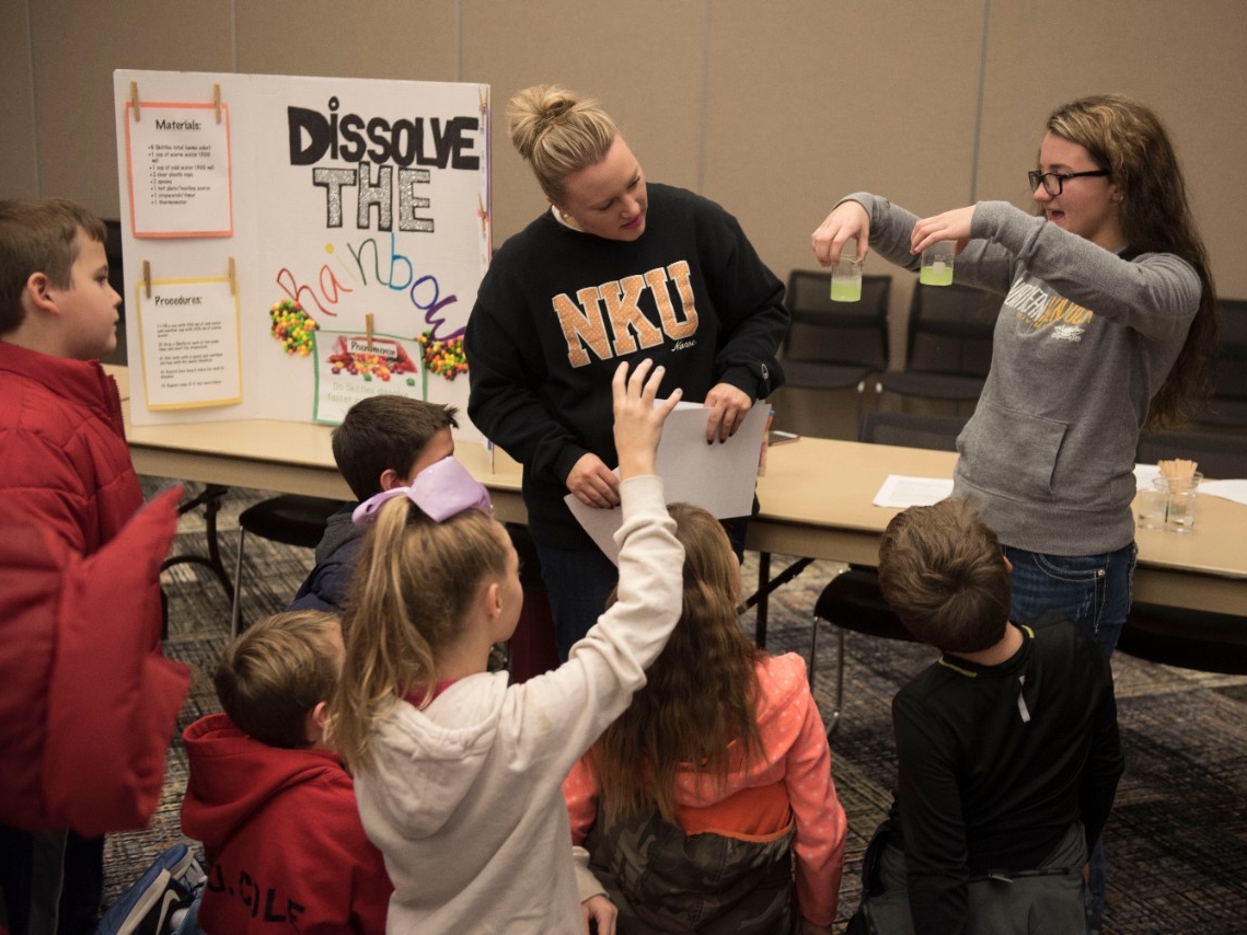 Student teachers teaching STEM subjects to elementary students