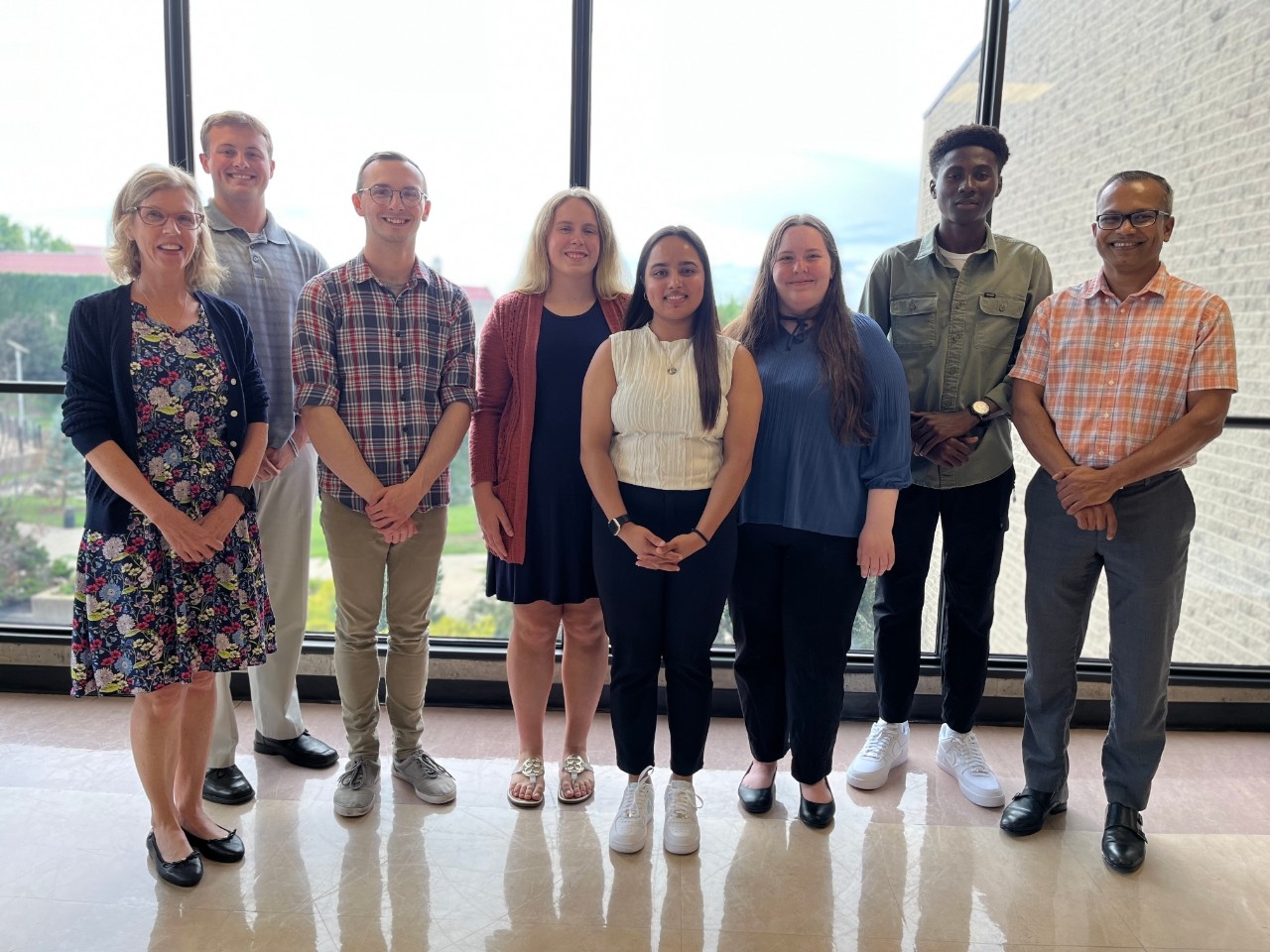 NKU Mathematics and Statistics students posing wiith faculty and industry partner