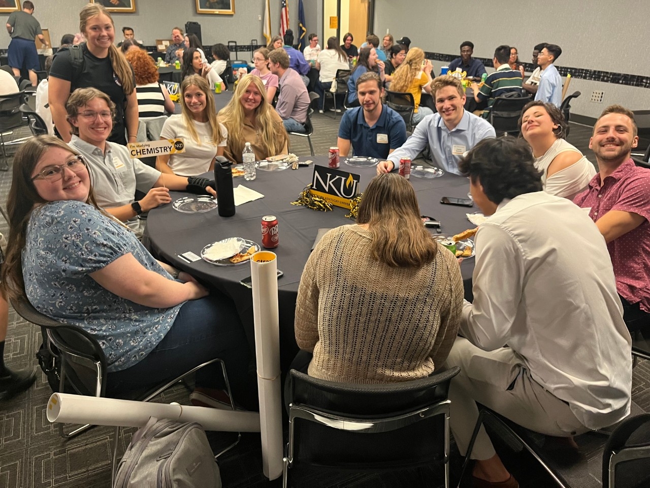 STEM majors smiling and having fun together at social event