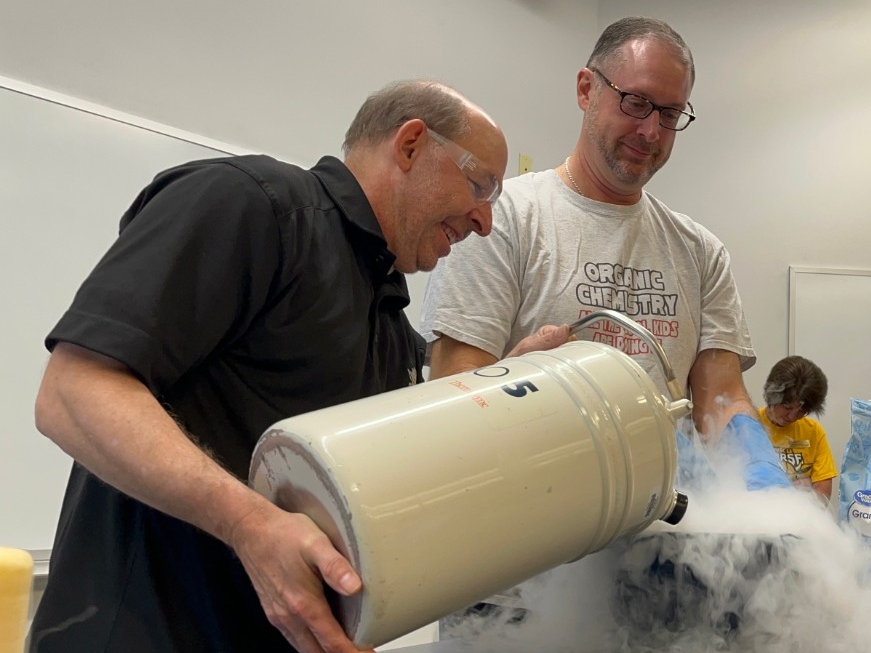 NKU Chemistry faculty having fun experimenting with liquid nitrogen.