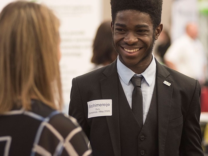 Student speaking with representative at Career Fair