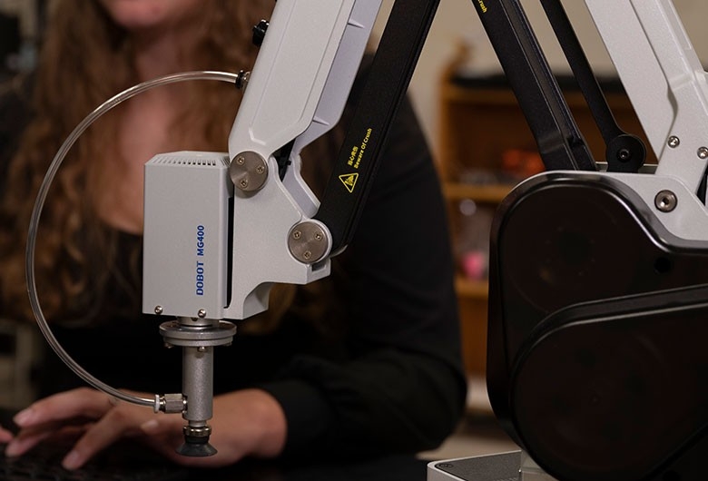 Student working with lab equipment