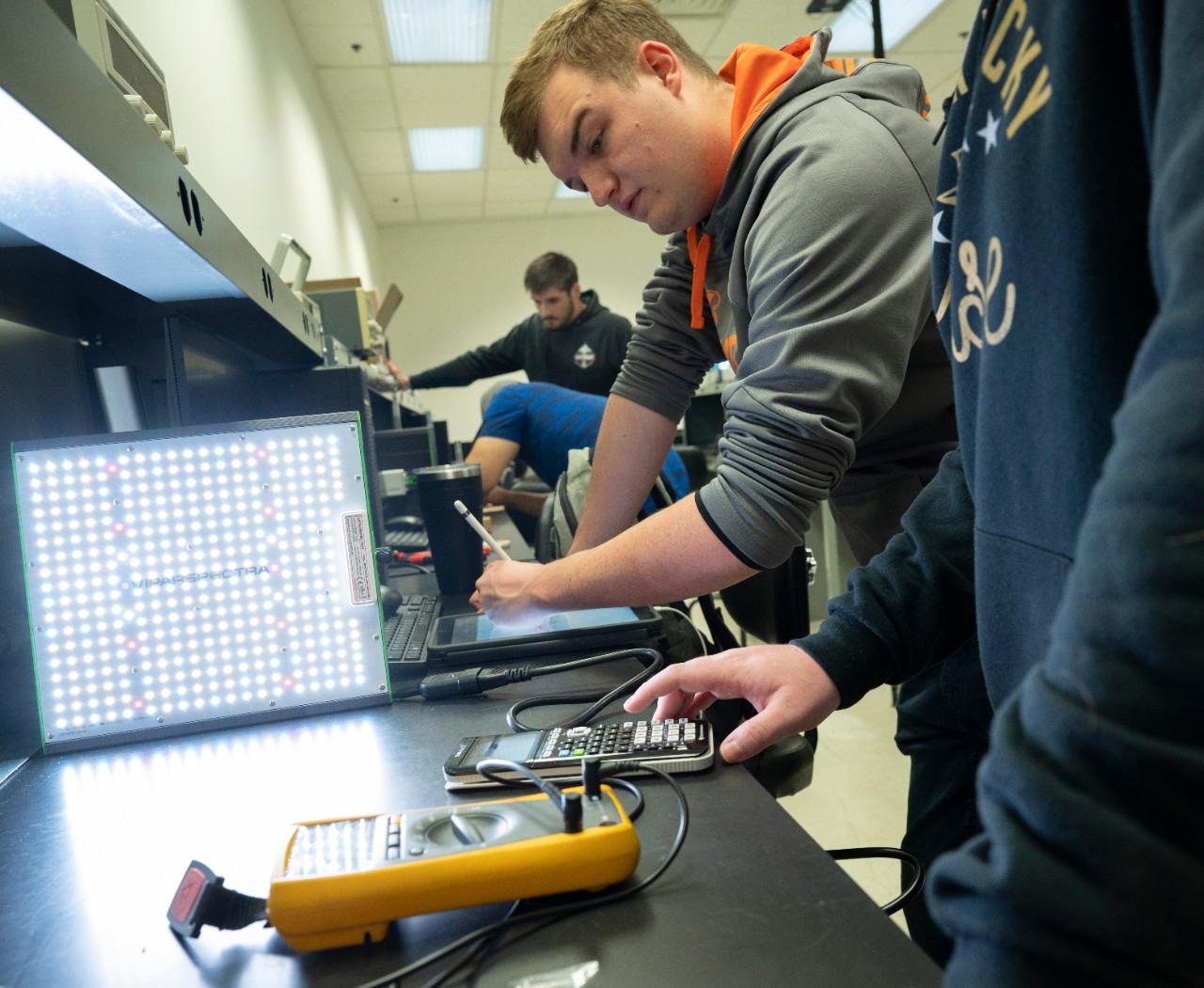 Group of students working on electronics.