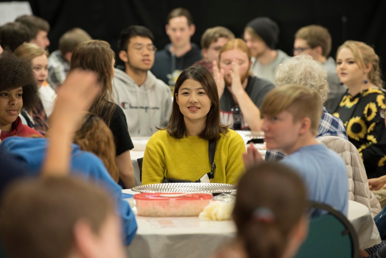 Students dining at a sushi event