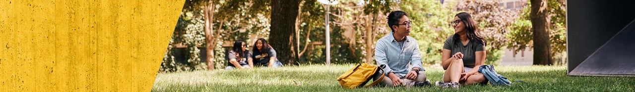 Students sitting together outdoors on NKU's campus