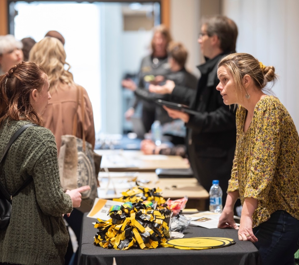 Professor speaking with a prospective student