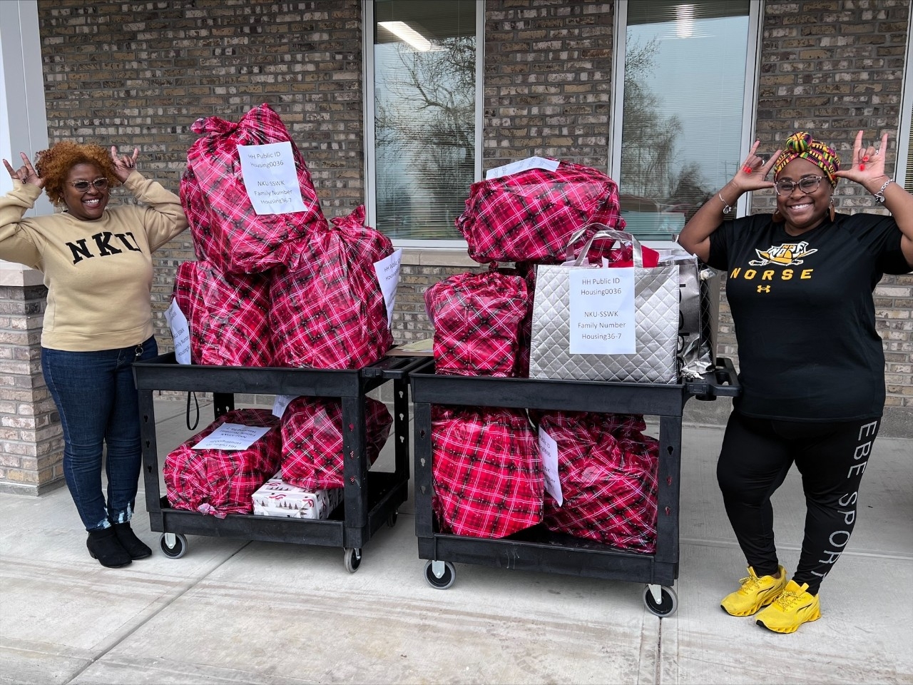 Social Work Professors Posing with Donated Gifts