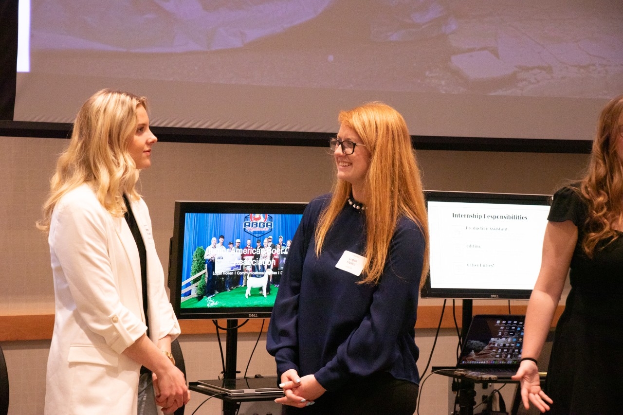 Students conversing at an internship reception