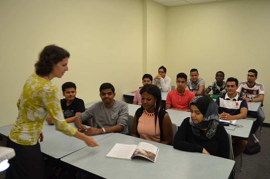 Professor instructing a classroom of students.