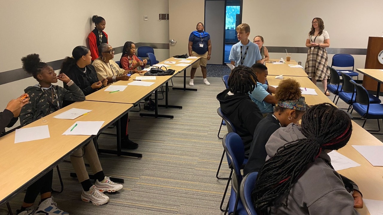 Students at National Geographic symposium presentation