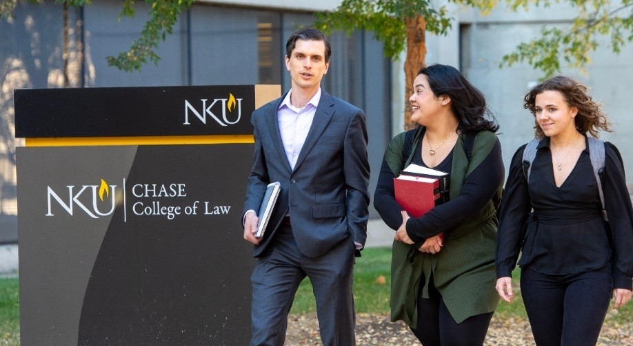 Students walk together outside the Chase College of Law. 