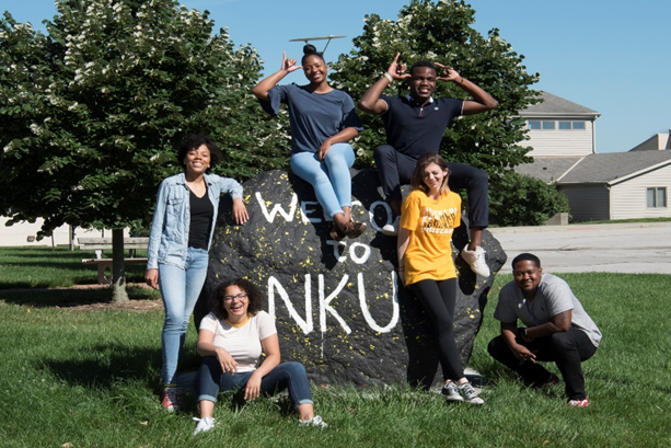 students gathered around the NKU Rock